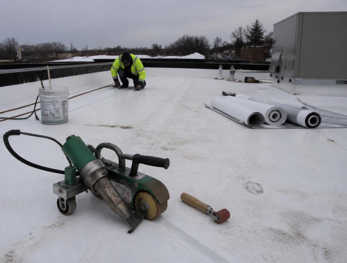 Commercial flat roof with a white TPO membrane