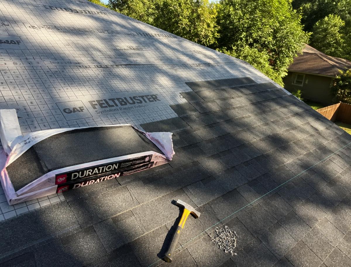 Charcoal architectural shingles going down over synthetic underlayment